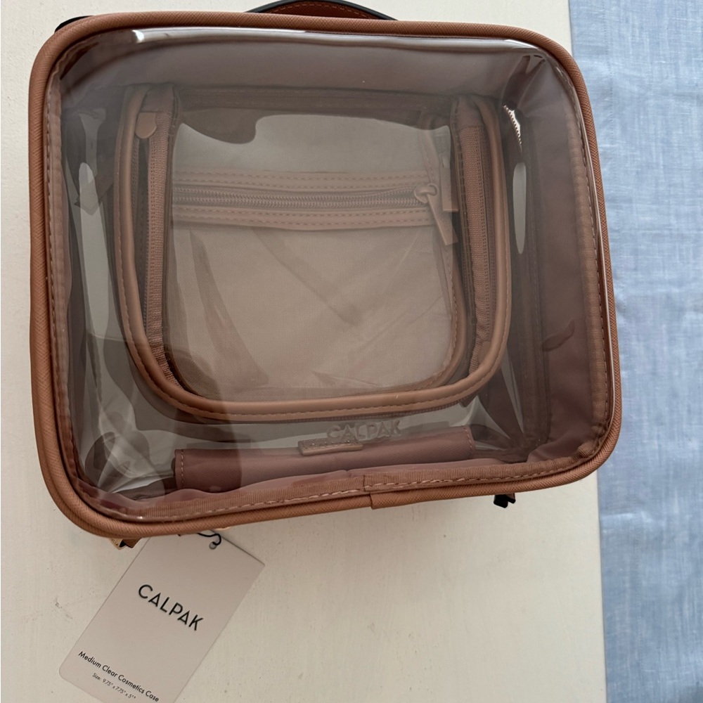 Calpak Transparent Travel Case with Brown Trim size medium. NWT